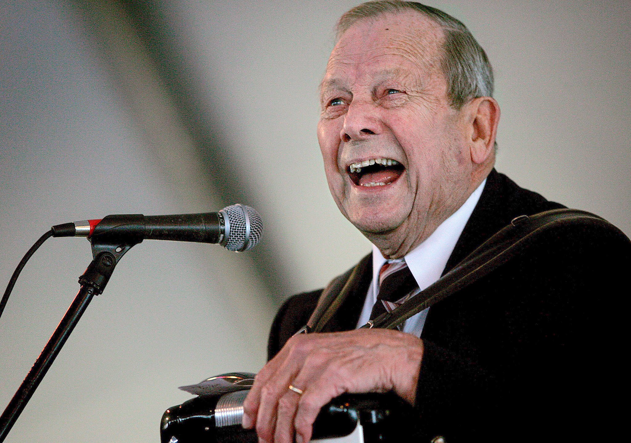 Stan Boreson, dubbed the “King of Scandinavian Humor,” tells a joke at the Everett Sausage Festival on Oct. 6, 2007. The Everett native and Camano Island resident passed away at age 91. Boreson once hosted a popular children’s television show on KING-TV, and performed at festivals and fairs. (Herald File Photo)