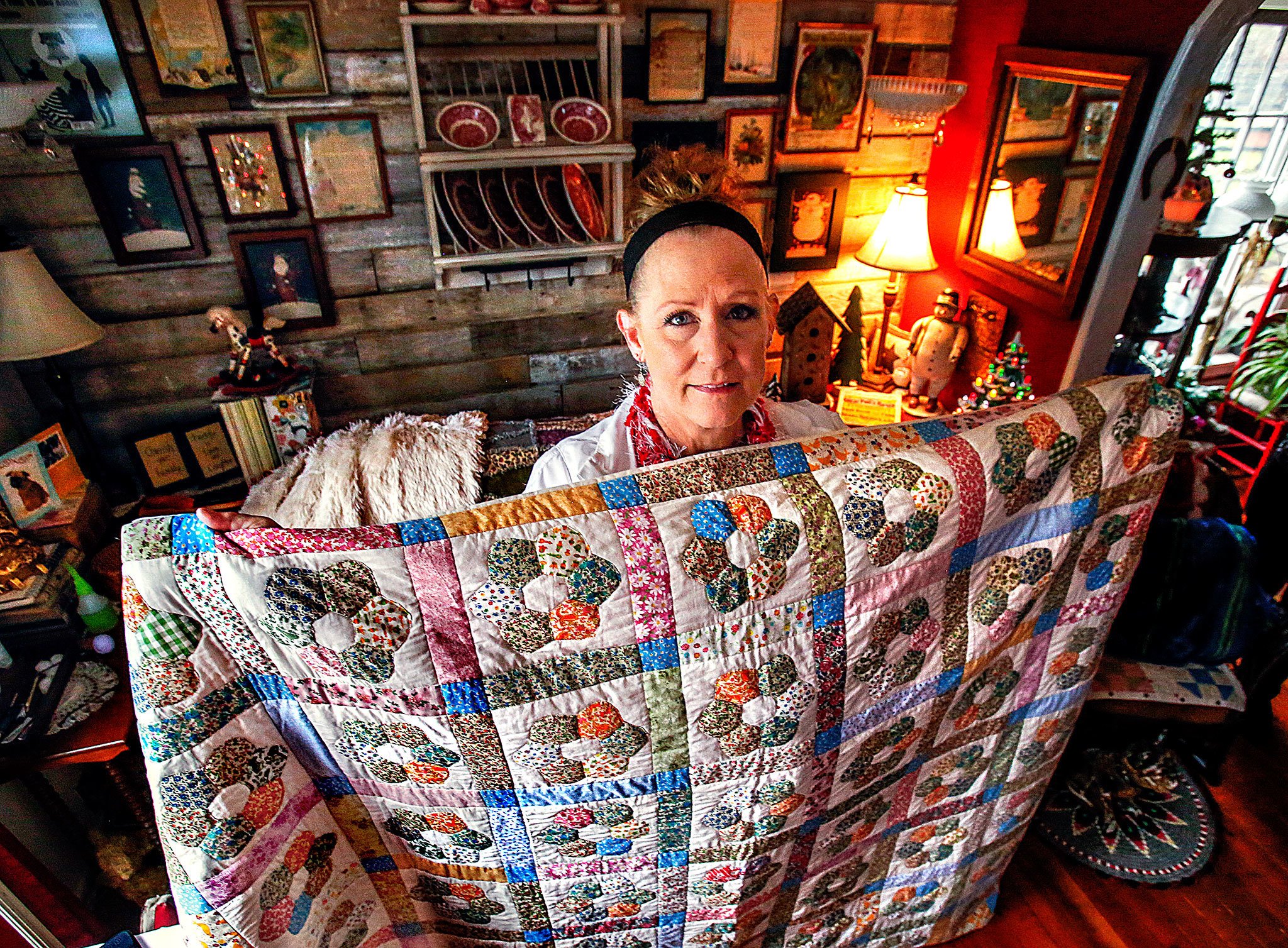 Karyn Nilson of Arlington acquired a partially completed quilt at a yard sale and finished it. She recently located the original intended recipient. (Dan Bates / The Herald)