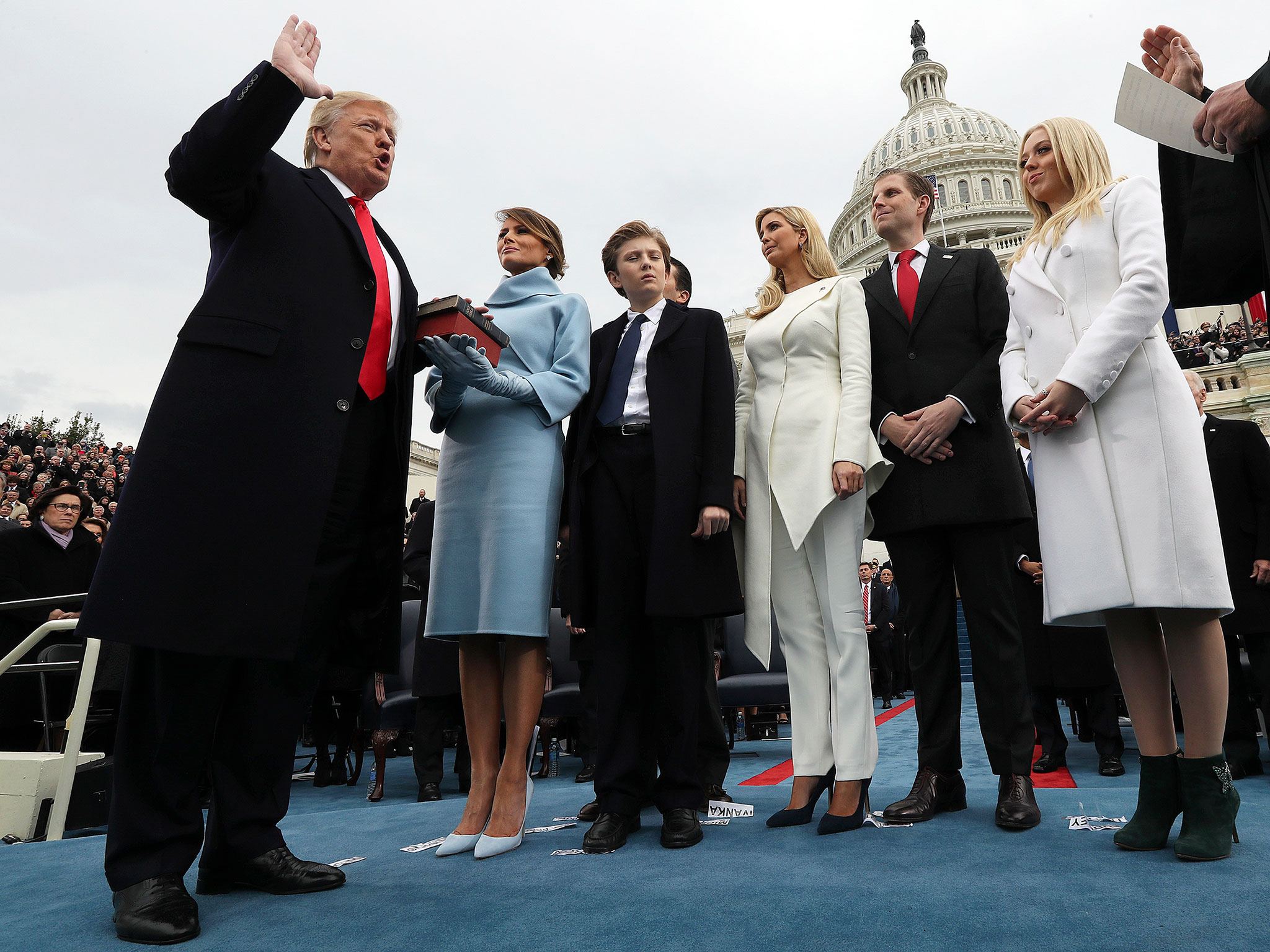 President-elect Donald Trump takes the oath of office from Chief Justice John Roberts, as his wife, Melania, holds the bible, and with his children Barron, Ivanka, Eric and Tiffany looking on Friday, Jan. 20, on Capitol Hill in Washington. (Jim Bourg/Pool Photo via AP)