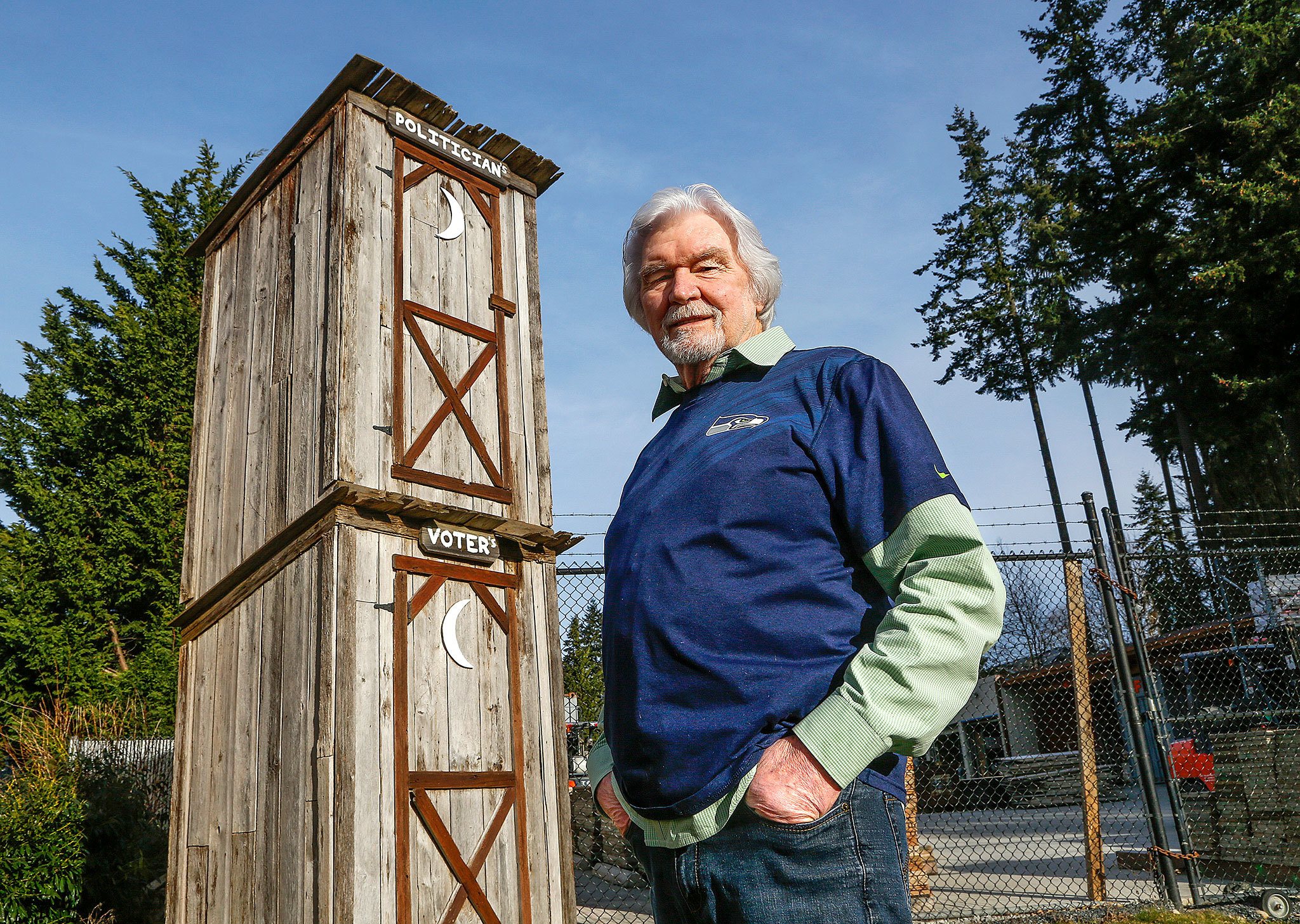 What’s Up about the two-story Politician/Voter outhouse behind Rustic Cuts barbershop in Silver Lake? Barber Don Baird, 76, built the outhouse from barnwood he had leftover when he built his barbershop 6 years ago as a statement about how voters get dumped on. (Dan Bates / The Herald)