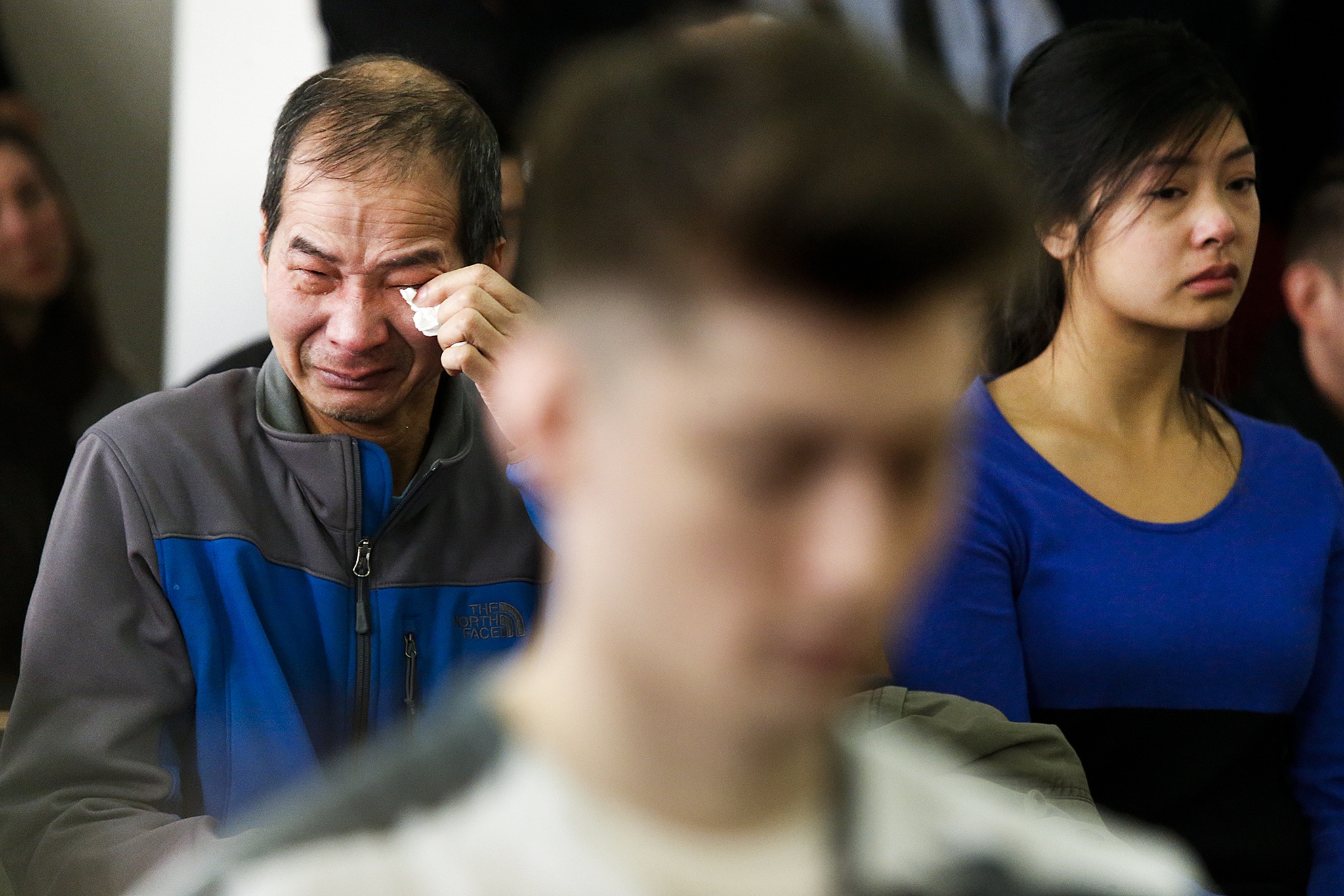Hung Bui (left), fights back tears with daughter Anny Bui during the sentencing for Allen Ivanov who shot and killed Bui’s daughter Anna, along with two others, at a house party in Mukilteo on July 30, 2016. Ivanov was sentenced to life in prison in Snohomish County Superior Court in Everett on Thursday morning. (Ian Terry / The Herald)