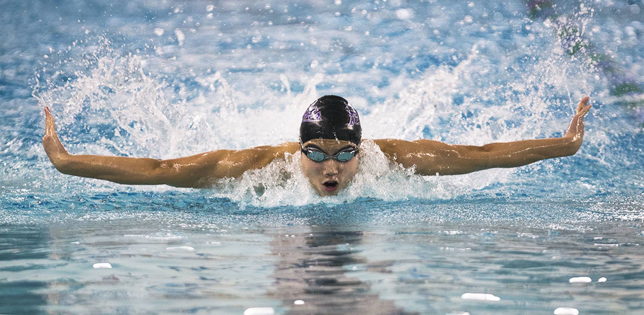 Kamiak’s Maxwell Fang swims in the 100 butterfly during a meet against Shorewood on Tuesday in Shoreline. Fang finished second in the event and Kamiak won the meet 93-92. (Daniella Beccaria / The Herald)