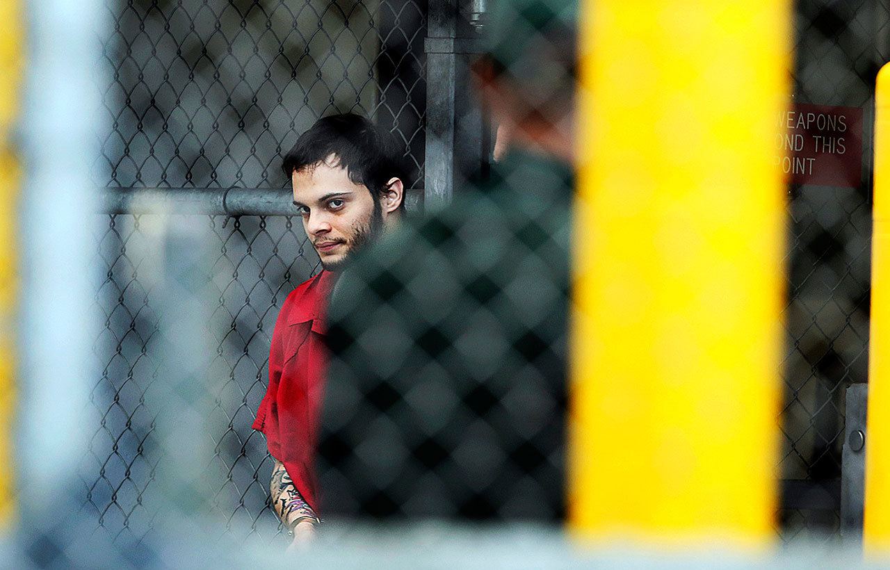 Esteban Santiago is taken from the Broward County main jail as he is transported to the federal courthouse in Fort Lauderdale, Florida, on Monday, Jan. 9. Santiago is accused of fatally shooting several people at a crowded Florida airport baggage claim and faces airport violence and firearms charges that could mean the death penalty if he’s convicted. (Amy Beth Bennett/South Florida Sun-Sentinel via AP)