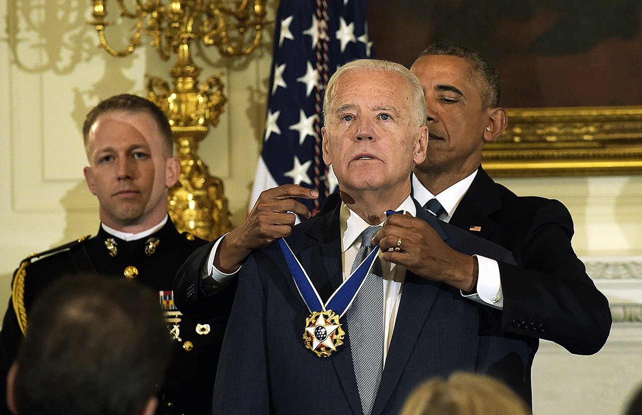 President Barack Obama presents Vice President Joe Biden with the Presidential Medal of Freedom during a ceremony in the State Dining Room of the White House in Washington on Thursday, Jan. 12. (AP Photo/Susan Walsh)