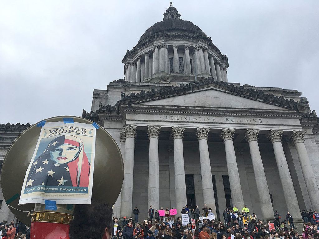 Protesters mark Inauguration Day on the steps of the state Capitol in Olympia on Friday. (AP Photo/Rachel La Corte)
