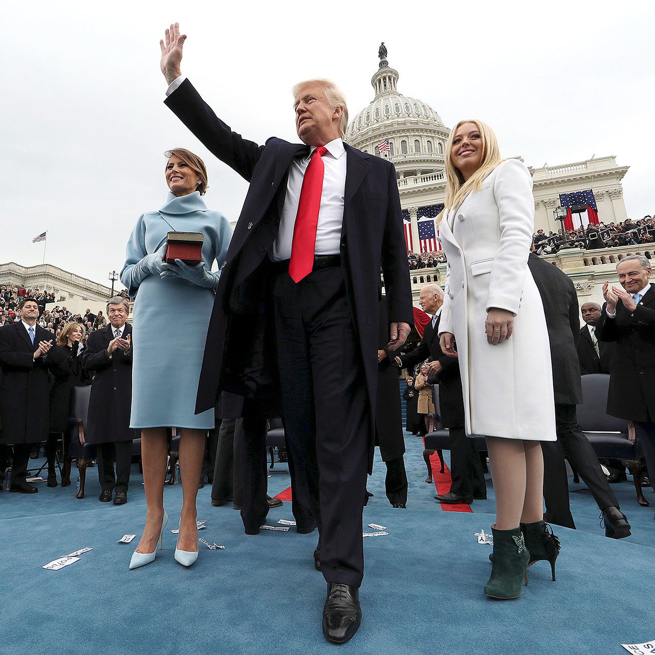 President Donald Trump waves after taking the oath of office at the Capitol in Washington, D.C., on Friday. At left is his wife, Melania. At right is daughter Tiffany. (Jim Bourg/Pool Photo via AP)