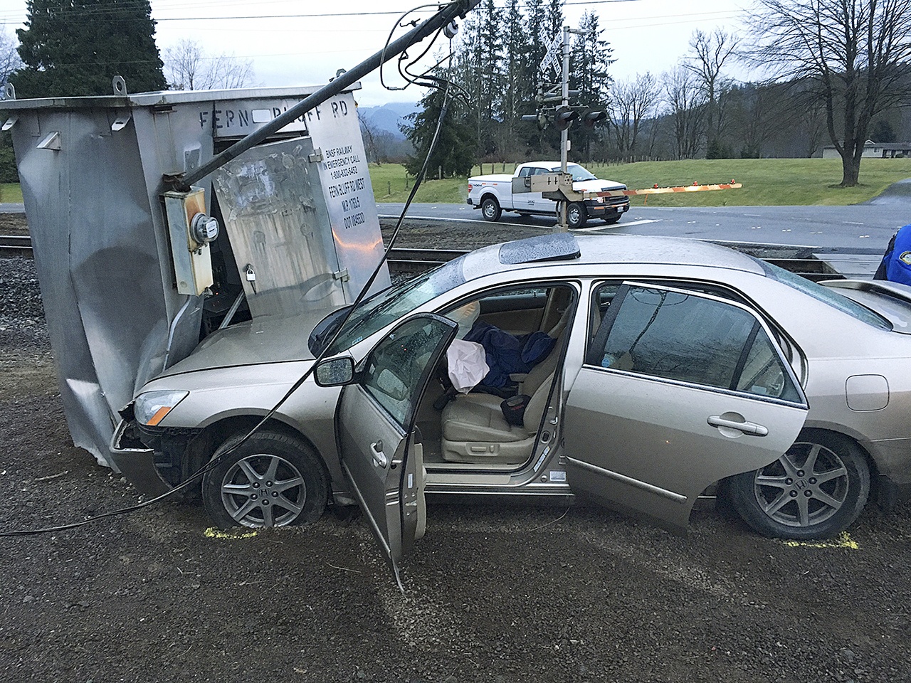 A car stolen from a man in Everett crashed into a Burlington Northern Santa Fe signal box in Monroe after a pursuit Wednesday. Two suspects were arrested. (Monroe Police Department)