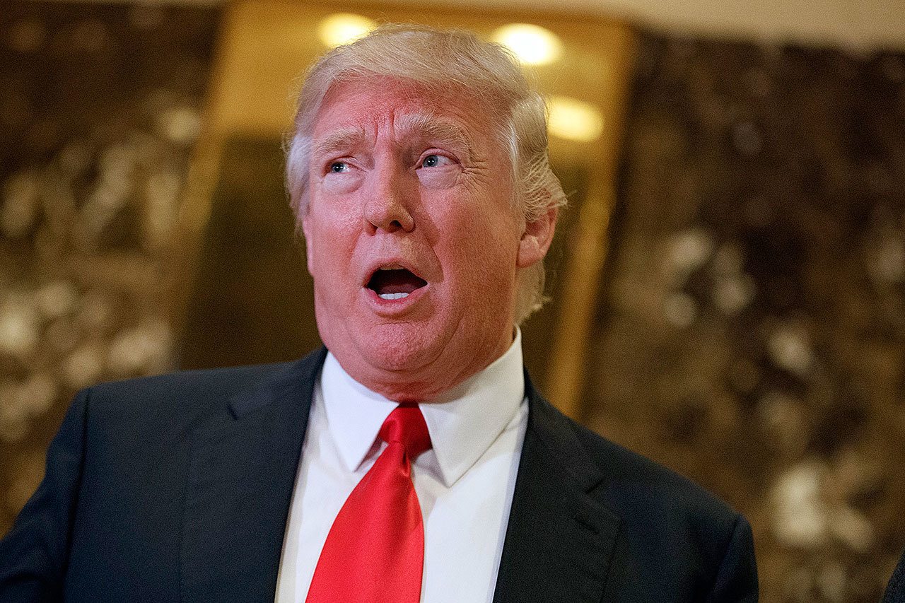 President-elect Donald Trump speaks in the lobby of Trump Tower in New York on Friday. (AP Photo/Evan Vucci)