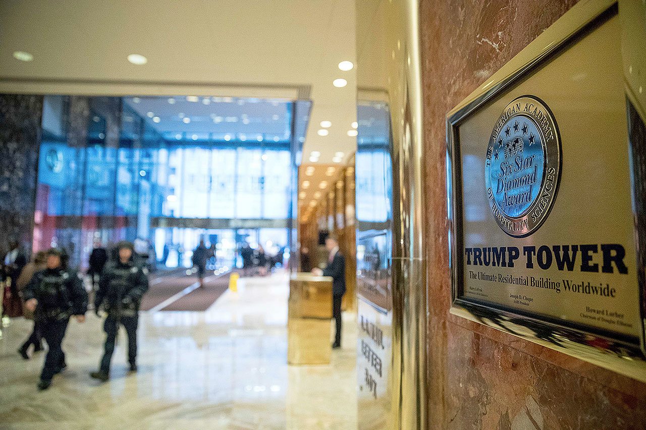 Police officers walk through the lobby of the Trump Tower in New York earlier this month. (AP Photo/Andrew Harnik)