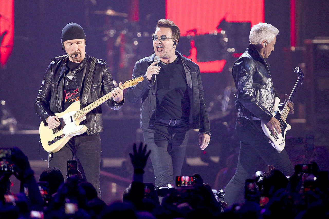 From left, the Edge, Bono and Adam Clayton of U2 perform in 2016. The Irish band will play the entirety of its classic 1987 album “The Joshua Tree” at each stop during a summer stadium tour to celebrate the 30th anniversary of its release. (Associated Press)
