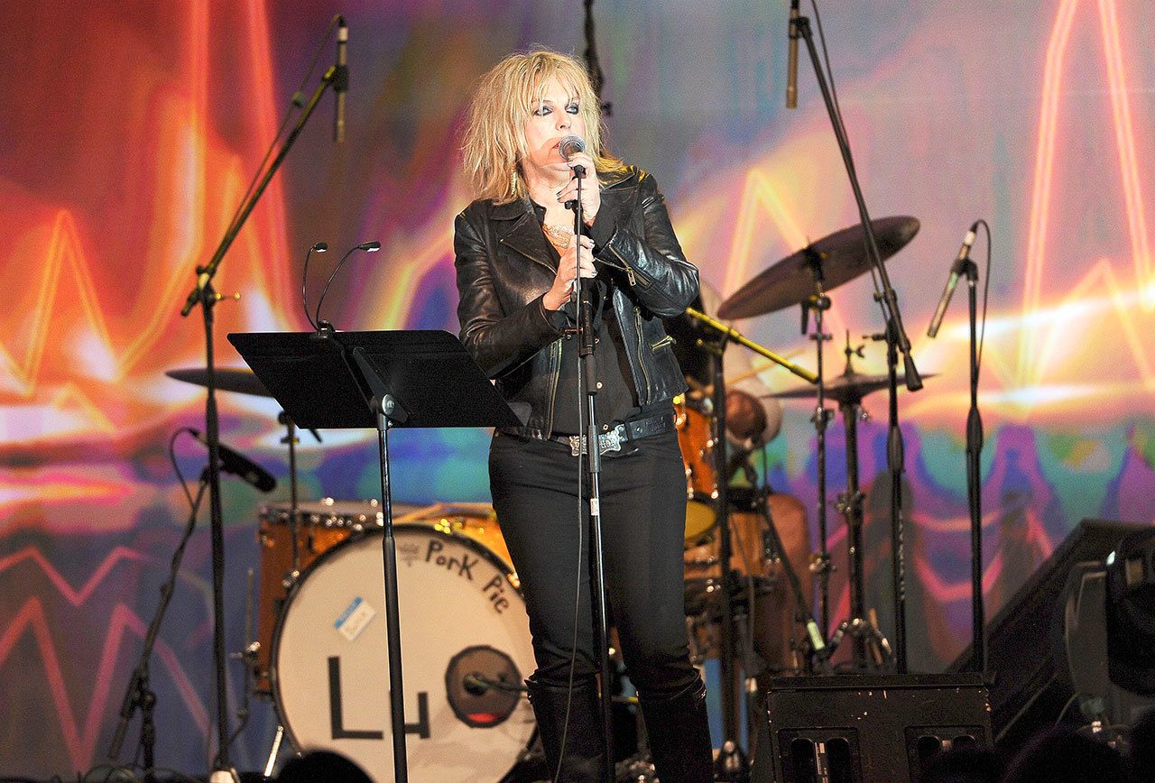 Lucinda Williams performs in 2014 in Los Angeles. She sings Jan. 25 at the Neptune in Seattle (Photo by Chris Pizzello/Invision/AP)