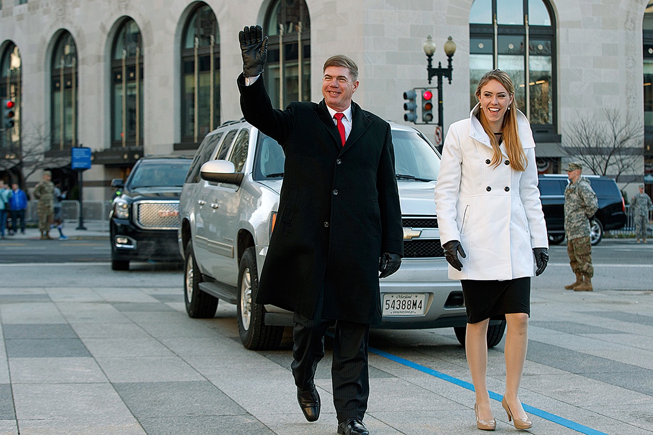 Army Sgt. Maj. Greg Lowery, playing the part of President-elect Donald Trump, and Army Spc. Sara Corry, playing the part of Melania Trump, walk along the parade route Sunday during a dress rehearsal for Inauguration Day. (AP Photo/Evan Vucci)