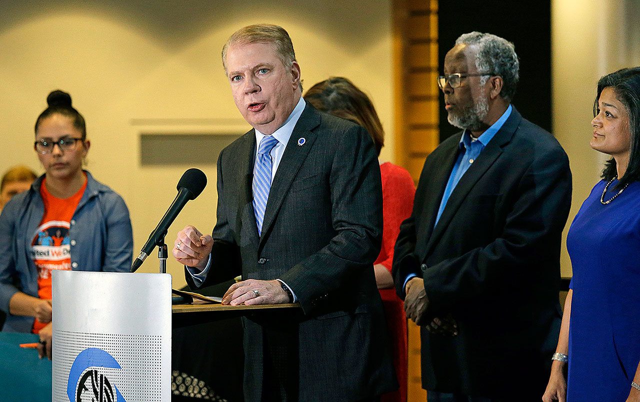 Seattle Mayor Ed Murray ( second left) speaks at a post-election event at City Hall in Seattle in November. (AP Photo/Elaine Thompson, File)