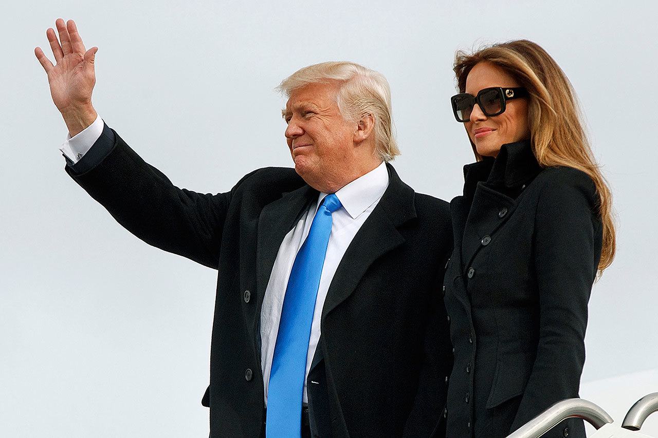 President-elect Donald Trump, accompanied by his wife, Melania Trump, waves as they arrive at Andrews Air Force Base, Maryland, on Thursday, Jan. 19, ahead of Friday’s inauguration. (AP Photo/Evan Vucci)