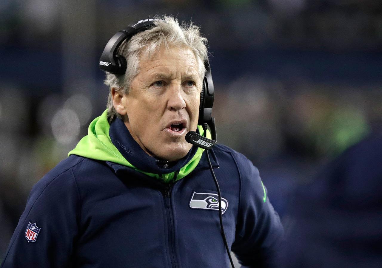 Seahawks head coach Pete Carroll watches from the sideline in the first half of a playoff game against the Lions this past Saturday in Seattle. (AP Photo/Elaine Thompson)