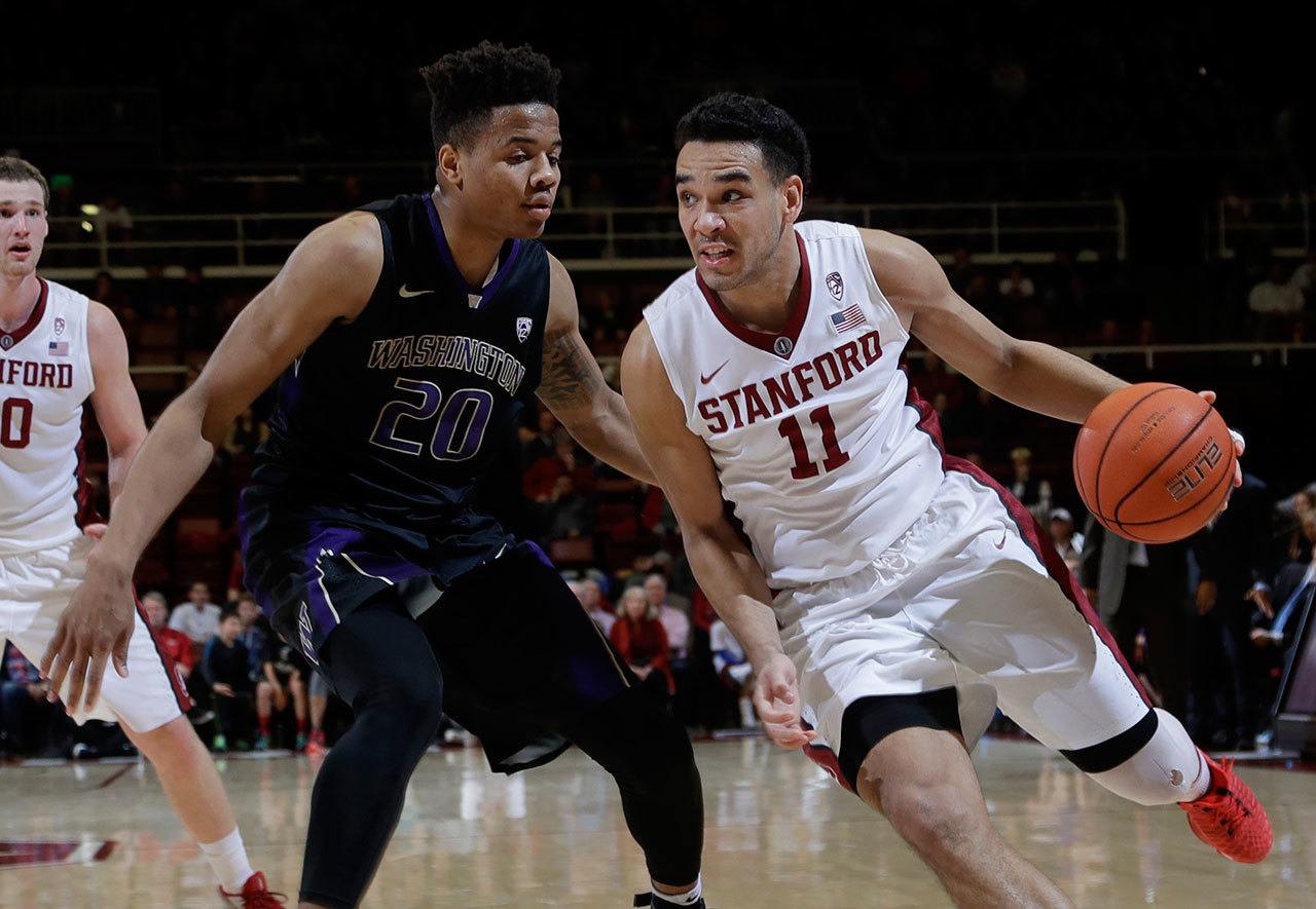 Stanford guard Dorian Pickens (11) dribbles past Washington guard Markelle Fultz (20) during the second half of a game this past Saturday in Stanford, Calif. (AP Photo/Marcio Jose Sanchez)