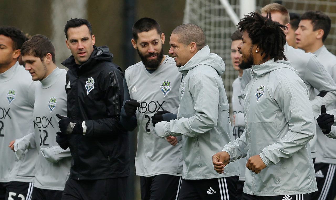 Sounders players, including forward Clint Dempsey (center) and team captain midfielder Osvaldo Alonso (second from right) jog during the first training session of the 2017 MLS season on Tuesday in Tukwila, Wash. (AP Photo/Ted S. Warren)