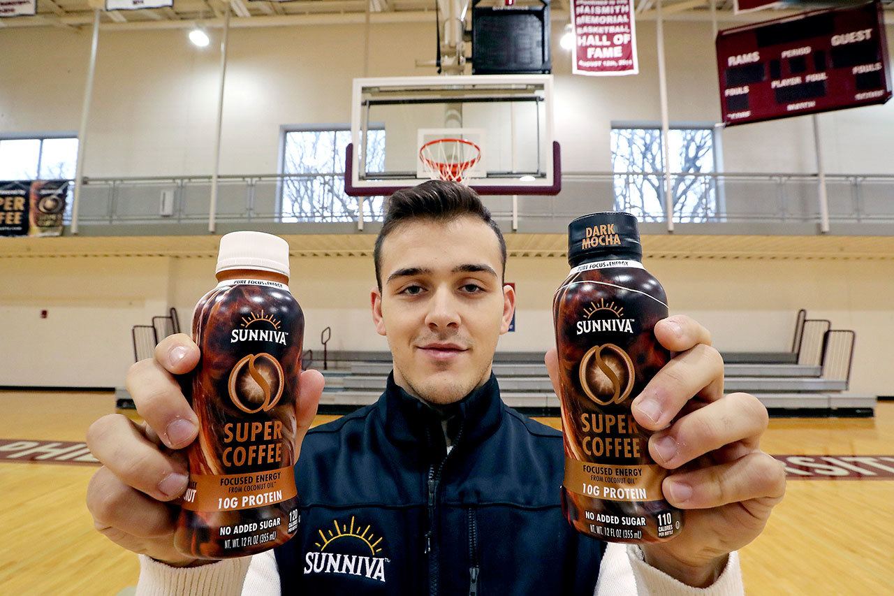 Philadelphia University point guard Jordan DeCicco with bottles of his Sunniva Super Coffee . (David Swanson / Philadelphia Inquirer)