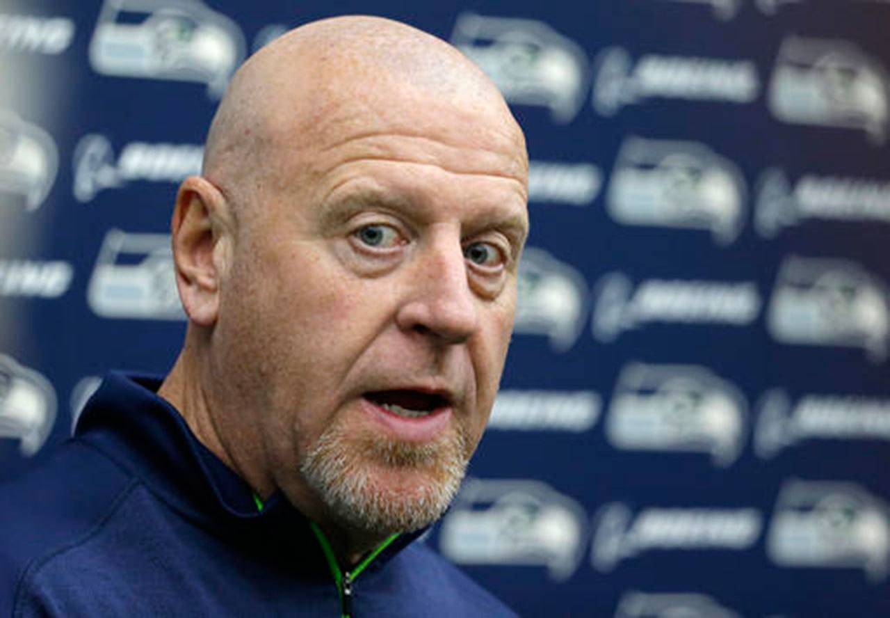 Tom Cable, the Seattle Seahawks’ offensive-line coach, talks to reporters on Jan. 10 at the team’s practice facility in Renton. Cable is a candidate to become head coach of the San Francisco 49ers. (AP Photo/Ted S. Warren)