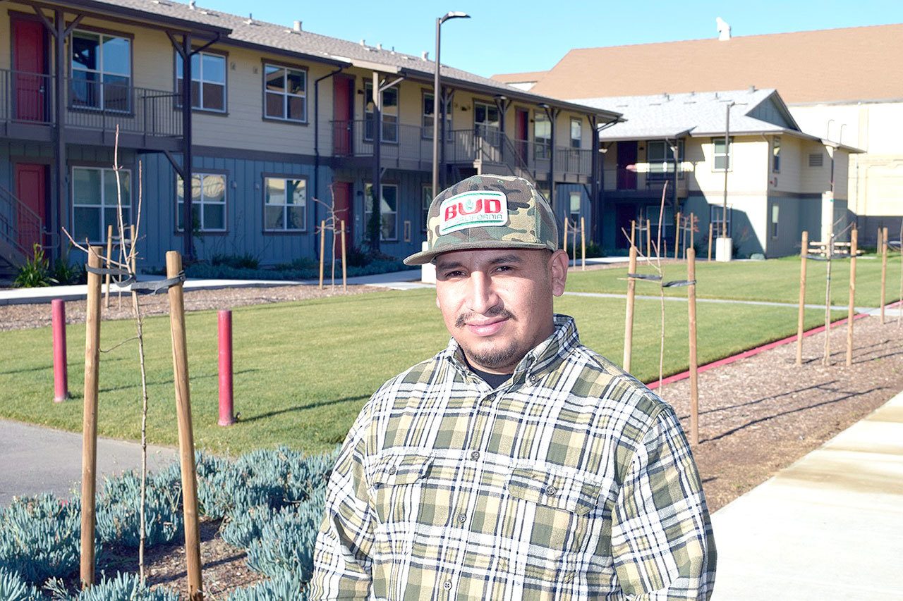 Apolonio Garcia, a farmworker for Tanimura & Antle, stands at the 100-unit housing project the company provided to attract workers. (Pew Charitable Trusts)