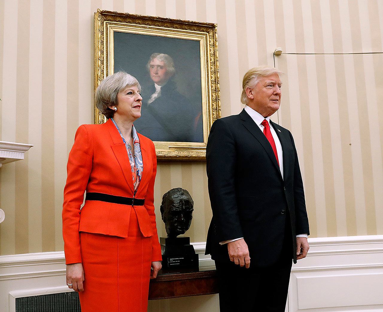 President Donald Trump stands with British Prime Minister Theresa May on Friday, Jan. 27, in the Oval Office of the White House in Washington. (AP Photo/Pablo Martinez Monsivais)