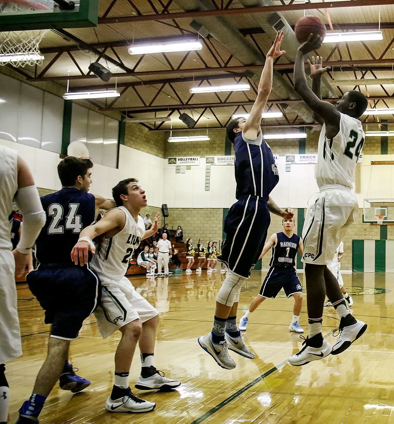 Erwin Weary of Cedar Park Christian attempts a shot over Rainier Christian’s Logan Hanbey Thursday night at Cedar Park Christian School in Mountlake Terrace on December 29, 2016. (Kevin Clark / The Herald)