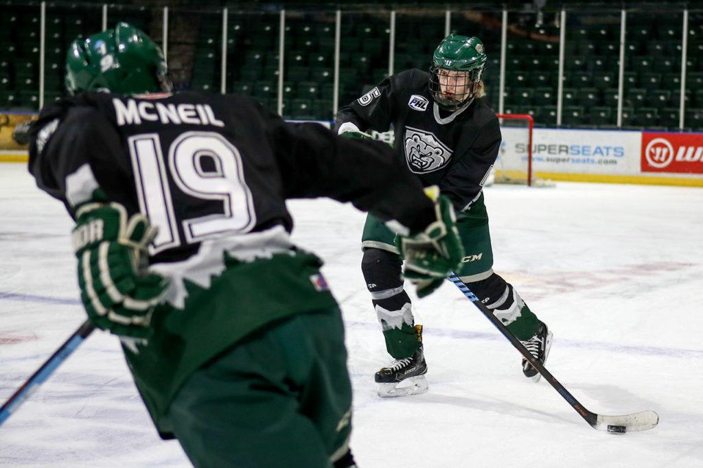 U16 Everett Junior Silvertips wingers Caden Pattison (right) and Jake McNeil work through drills during practice Jan. 11 at Xfinity Arena in Everett. (Kevin Clark / The Herald)
