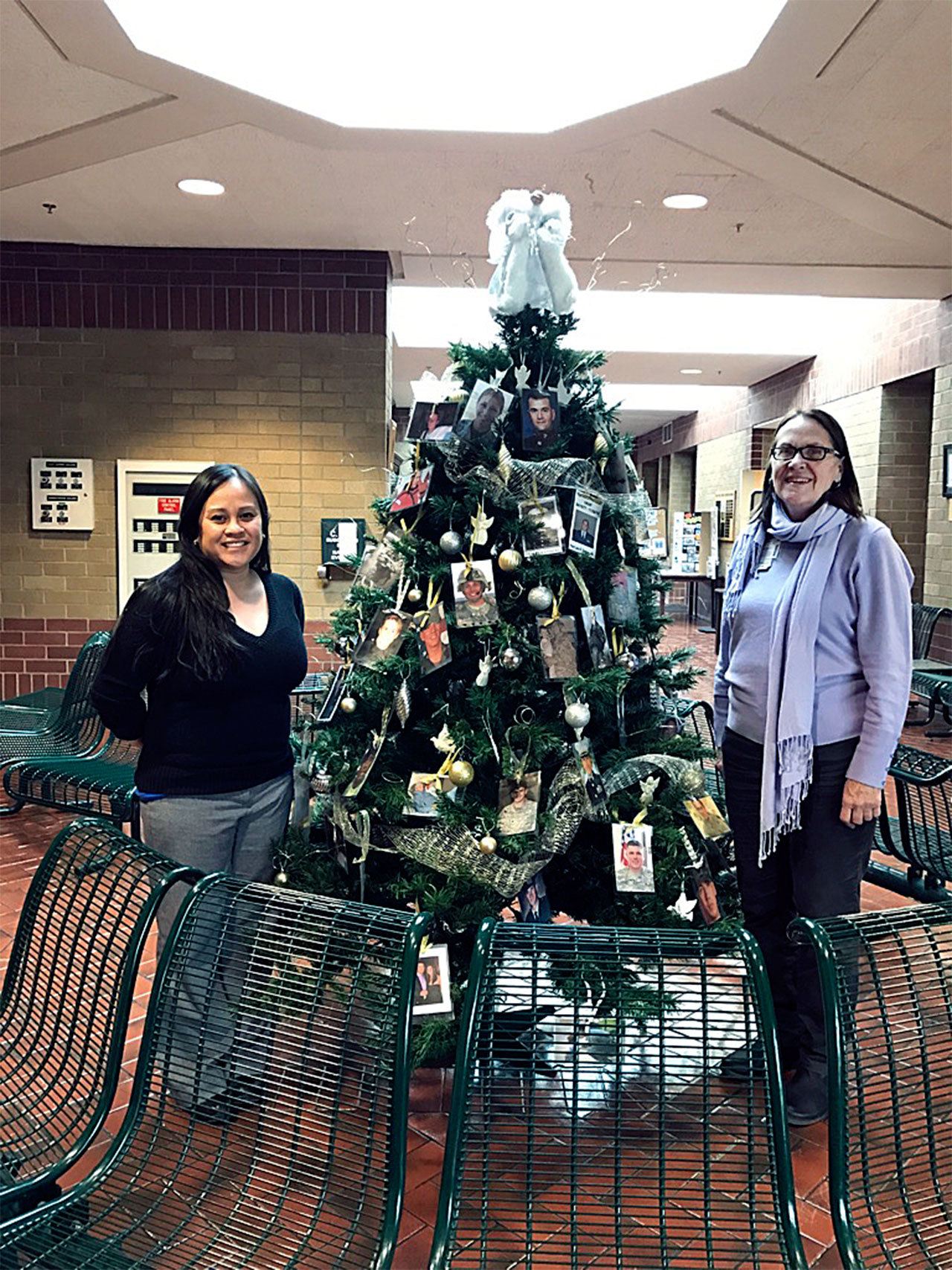The Hero Tree, honoring and remembering Washington Fallen Heroes, was on display at Naval Station Everett over the holidays thanks to the Navy Gold Star Program, as represented by Tina Soukup (left), and the American Gold Star Mothers of Washington, represented by Myra Rintamaki. (Contributed photo)