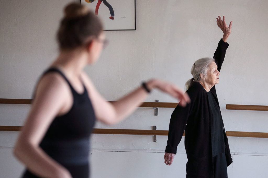 
Lida Smith, 86, works with modern dance student Kaitlyn Bostrom, 18, earlier this month at The Dance School in Everett.
 (Kevin Clark / The Herald) 
