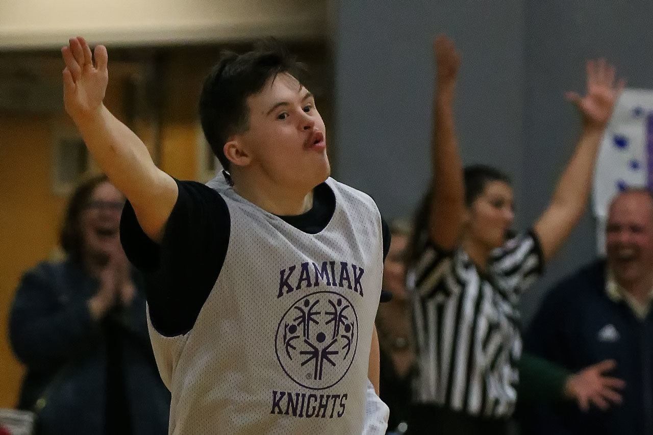 Kamiak’s Christian Hardman celebrates his 3-pointer during the Knights’ 43-34 Unified basketball victory over Mariner in Mukilteo on Thursday. It was the first-ever Unified game between the two schools in the Mukilteo School District.