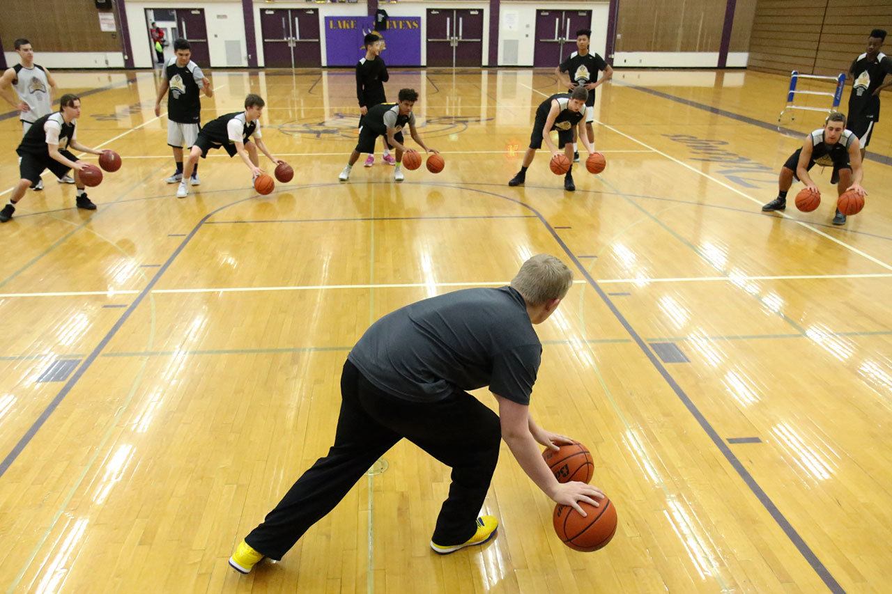 Former Lake Stevens basketball player Dylin Stoen leads a conditioning drill known as “Dylin Time” on Friday at Lake Stevens High School. (Kevin Clark / The Herald)