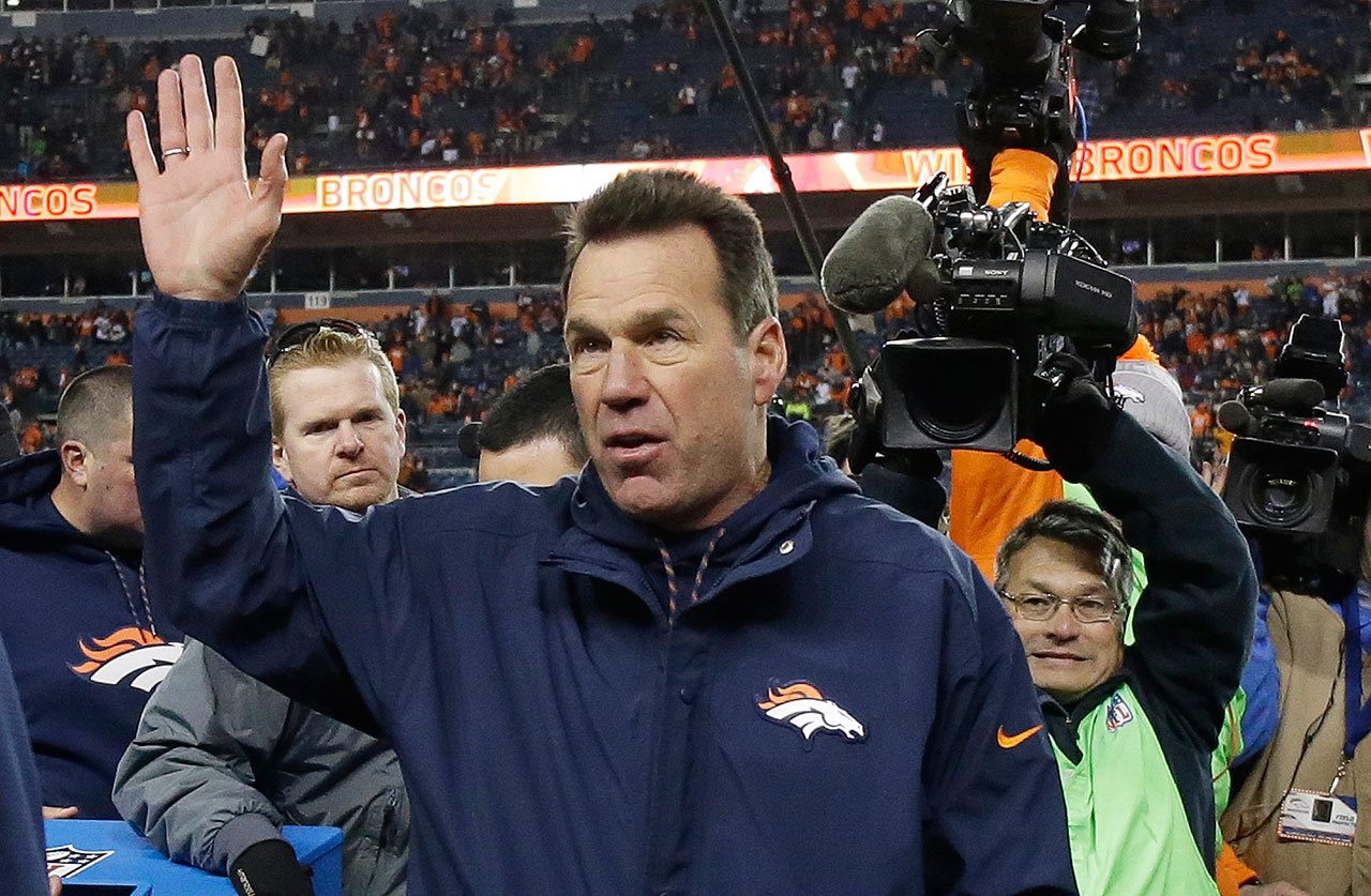 Denver Broncos coach Gary Kubiak waves as he walks off the field after the team’s game against the Oakland Raiders on Sunday. The Broncos won, 24-6, in what proved to be Kubiak’s final game as their head caoch. (AP Photo/Jack Dempsey)