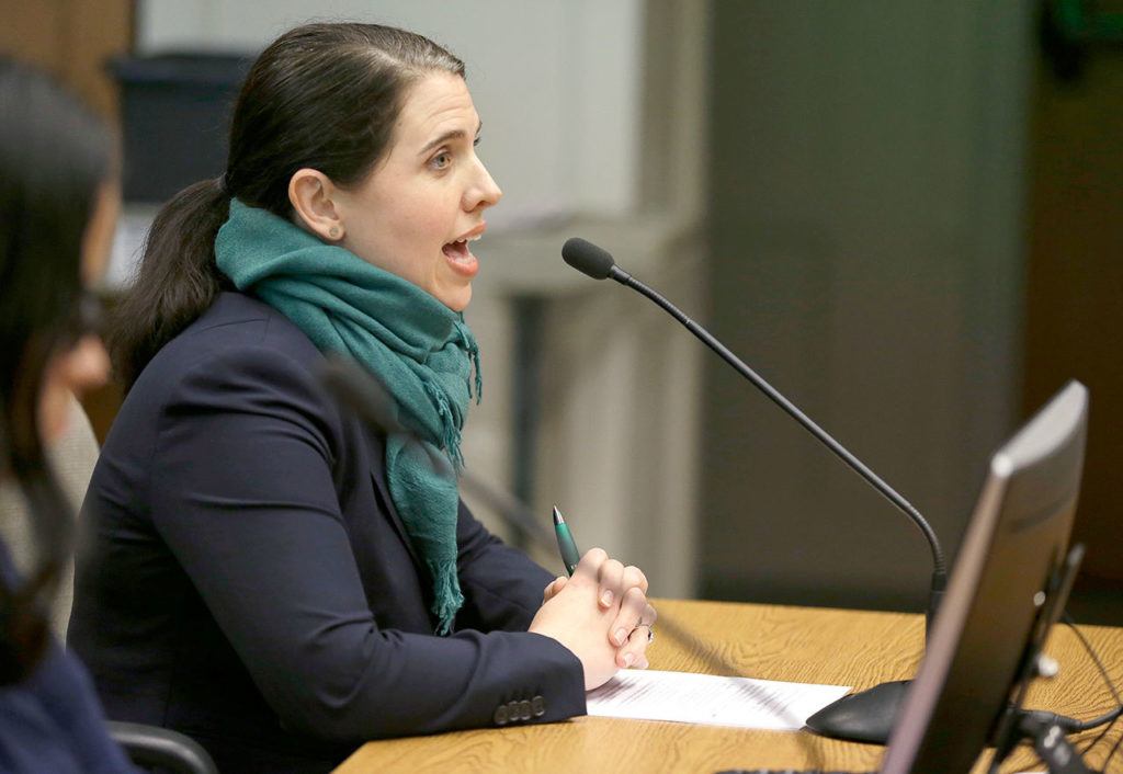 Elisabeth Smith, legislative director for the Washington American Civil Liberties Union, speaks during the hearing. (Ted S. Warren / Associated Press)
