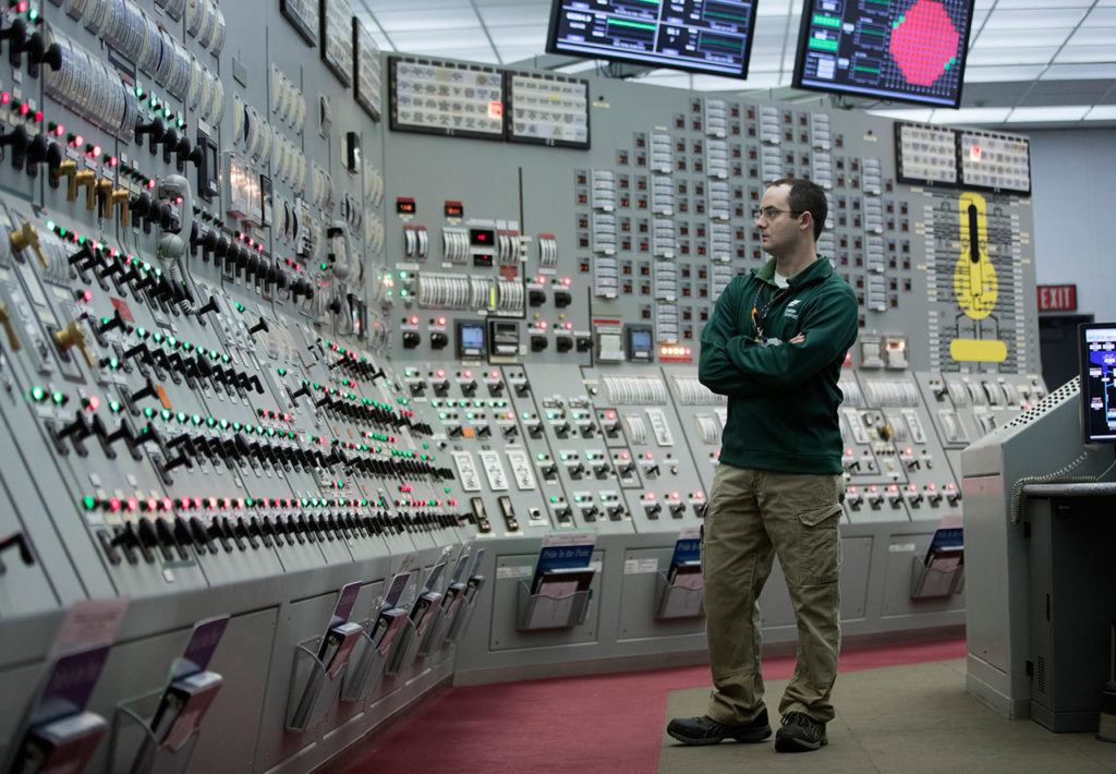 Reactor operator Patrick Ryan works in the Unit 1 control room at Nine Mile Point nuclear power plant in Oswego, N.Y. New York state is betting big on the future of Nine Mile Point, one of the nation’s oldest nuclear plants. The state is putting up $7.6 billion in subsidies to ensure that the plant and two other upstate nuclear plants stay open, part of New York’s strategy to lean on nuclear energy as it ramps up renewable sources such as wind, solar and hydroelectric. (AP Photo/Mike Groll)
