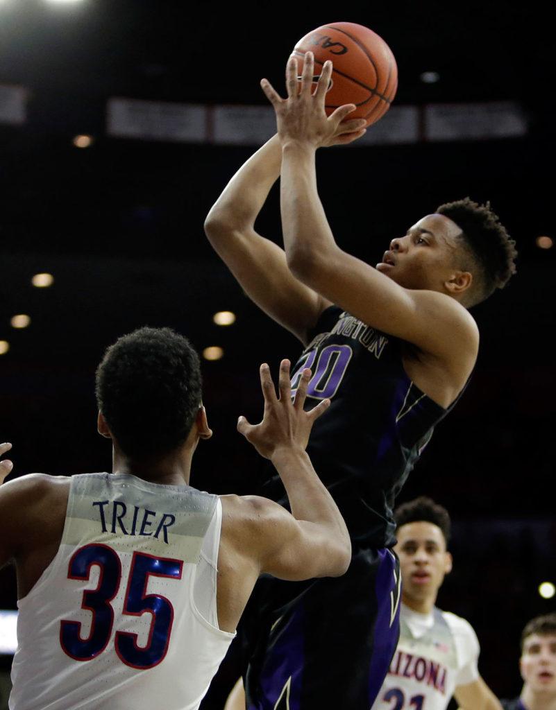 Washington guard Markelle Fultz (20) shoots over Arizona guard Allonzo Trier during the first half of the Pac-12 game Sunday, Jan. 29, in Tucson, Ariz. (AP Photo/Rick Scuteri)
