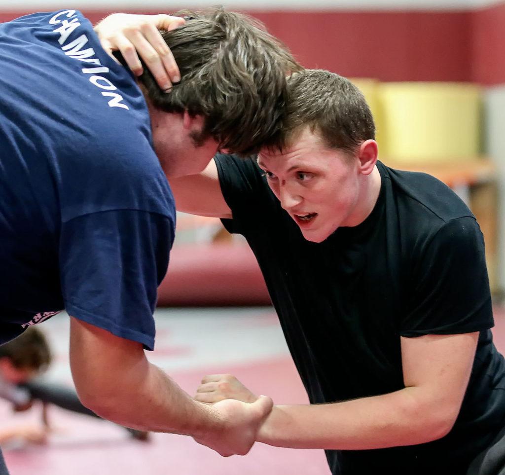 Cascade wrestlers Adam Holston (right) and Andrew Raymond work out during practice on Jan. 18 in Everett. (Kevin Clark / The Herald)
