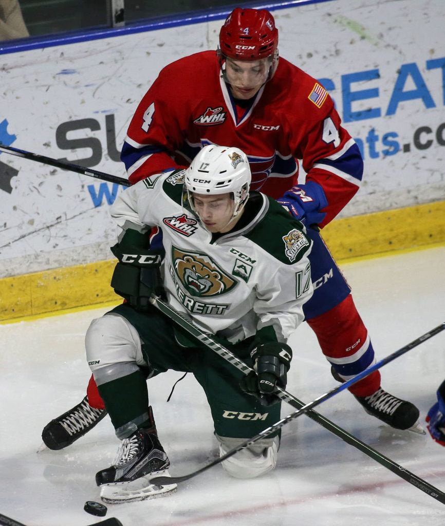 Everett’s Matt Fonteyne vies for control of the puck with Spokane’s Jeff Faith on his back during the Silvertips’ 5-0 win over the Chiefs on Wednesday night at Xfinity Arena in Everett. (Kevin Clark / The Herald)
