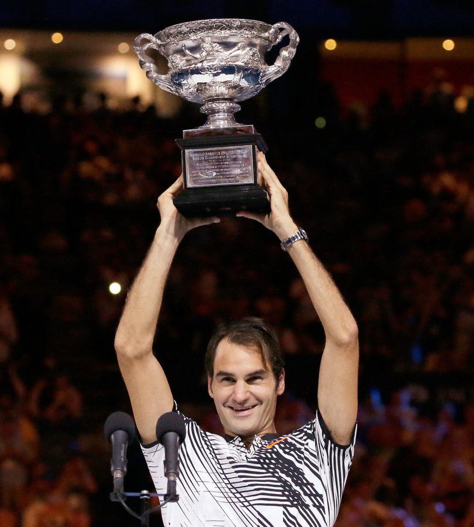 Switzerland’s Roger Federer holds his trophy after defeating Spain’s Rafael Nadal in the men’s singles final at the Australian Open tennis championships in Melbourne, Australia, Sunday, Jan. 29, 2017. (AP Photo/Aaron Favila)
