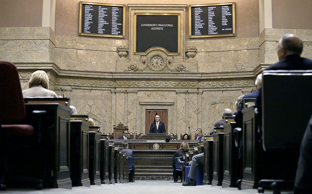 Gov. Jay Inslee gives his inaugural address to a joint session of the Legislature on Wednesday as he begins his second term, Jan. 11, in Olympia. (AP Photo/Elaine Thompson)
