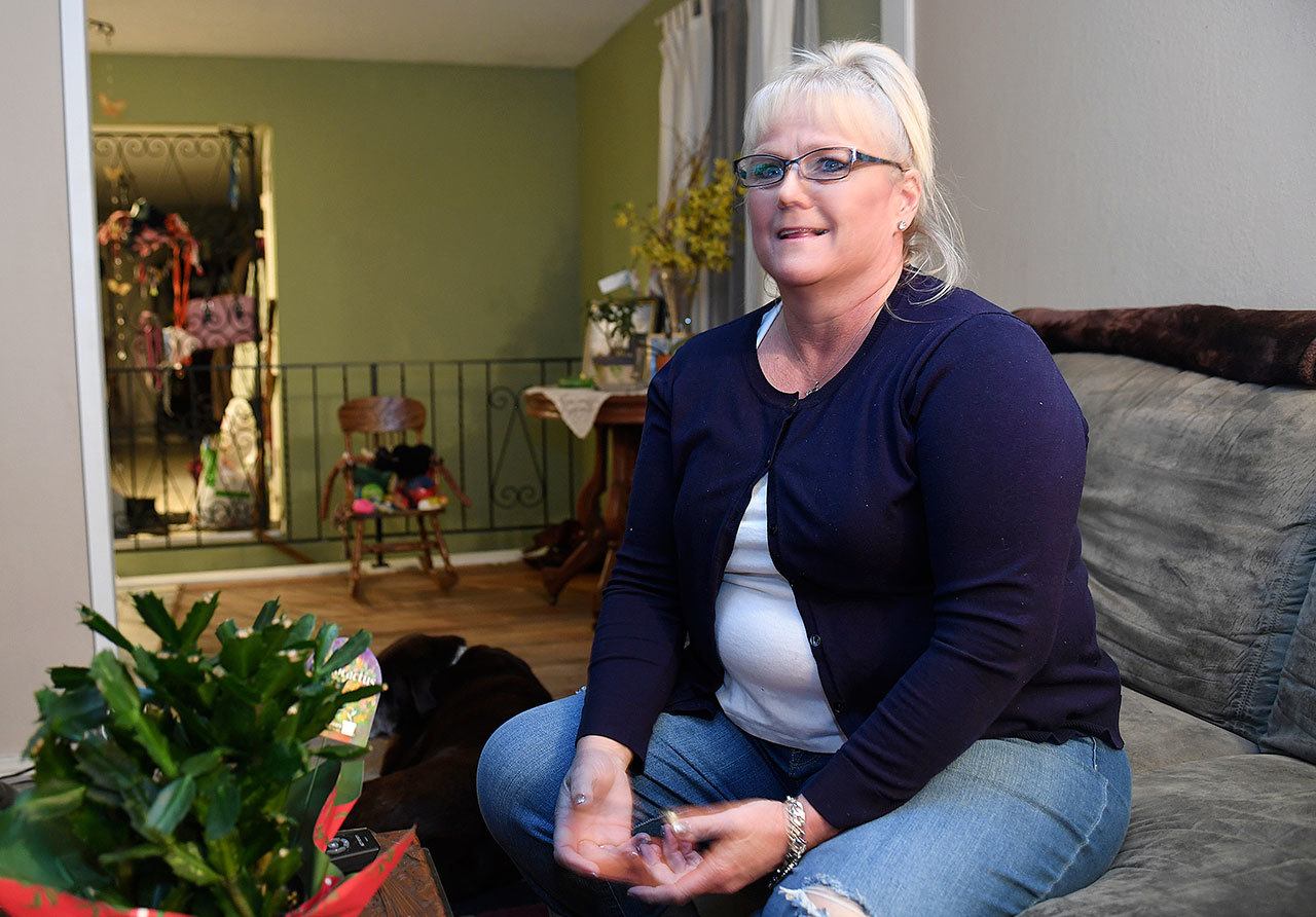 Kim Novak is interviewed at her home in North Spokane on Sunday. Novak, who was trapped in a burning car, is hailing a Washington state officer as a hero after he bashed in her window and pulled her to safety. (Jesse Tinsley / The Spokesman-Review)