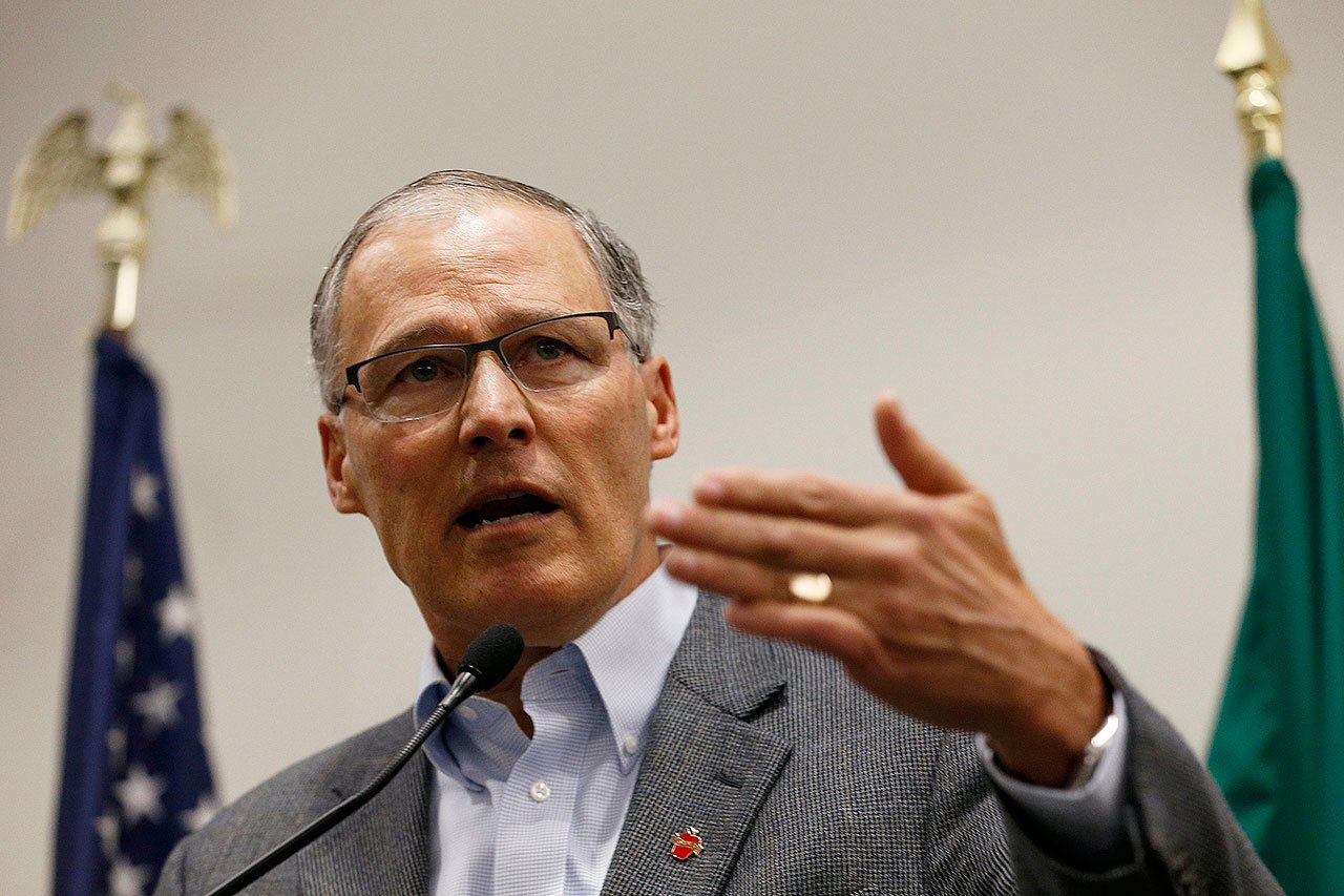 Gov. Jay Inslee speaks to the media in the Airport Office Building at Seattle-Tacoma International Airport on Saturday. Inslee blasted President Donald Trump’s executive order banning people from certain Muslim-majority nations as “unjustifiable cruelty.” (Logan Riely / The Seattle Times)