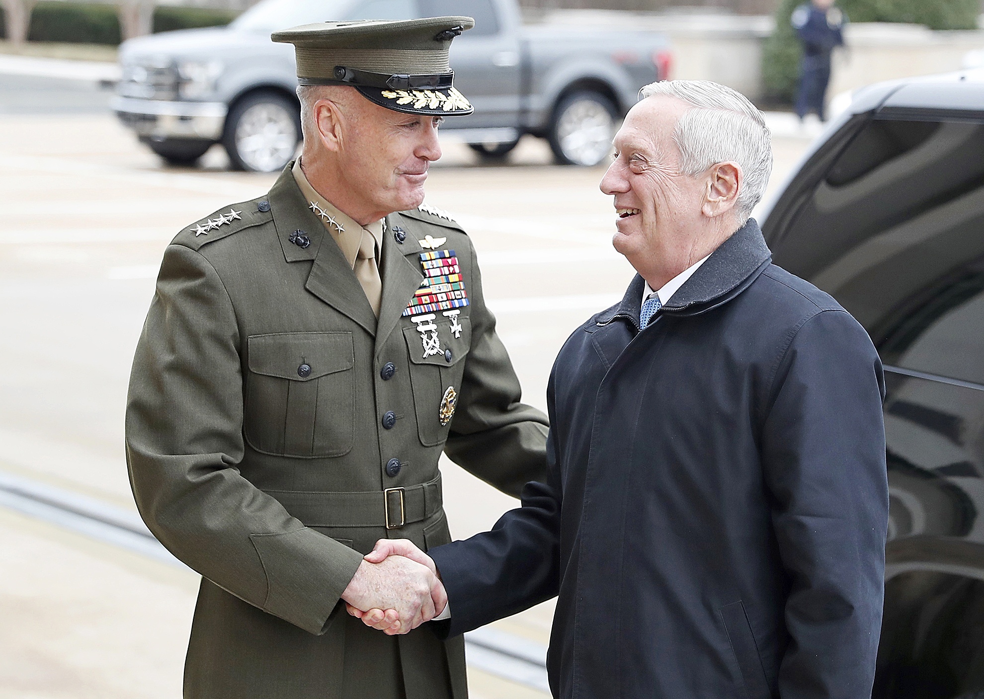 Alex Brandon / Associated Press                                Joint Chiefs Chairman Gen. Joseph Dunford greets Defense Secretary James Mattis at the Pentagon on Jan. 21.