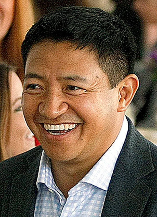 Developer Lobsang Dargey (center) attends a sneak peak event at Potala Place Everett on April 30, 2015.                                (Ian Terry / The Herald)