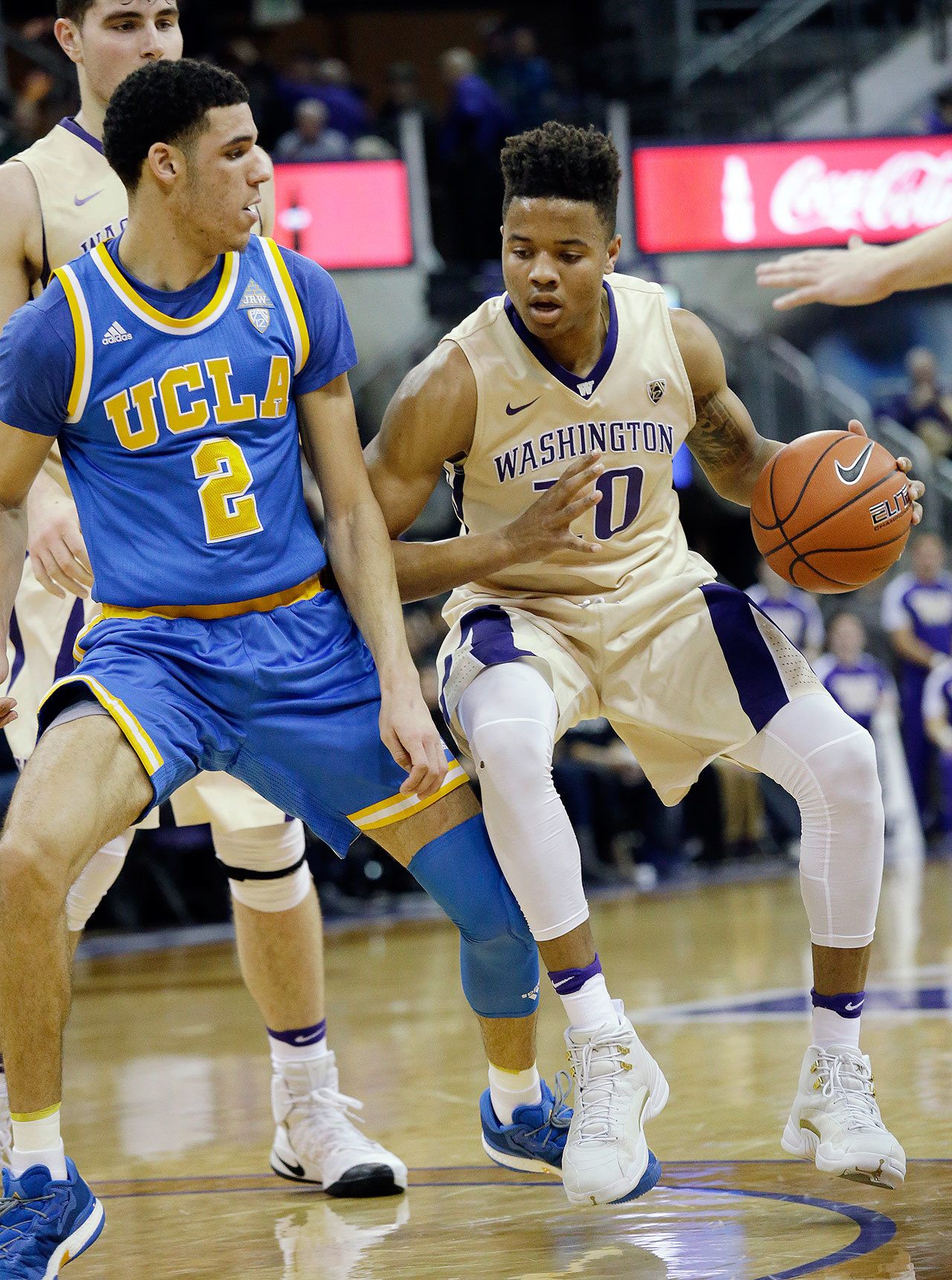 Washington’s Markelle Fultz (20) is defended by UCLA’s Lonzo Ball in a matchup of star freshman guards during the Bruins’ 107-66 thrashing of the Huskies in front of a sold-out crowd at Hec Edmondson Pavilion on Saturday in Seattle. (AP Photo/Elaine Thompson)