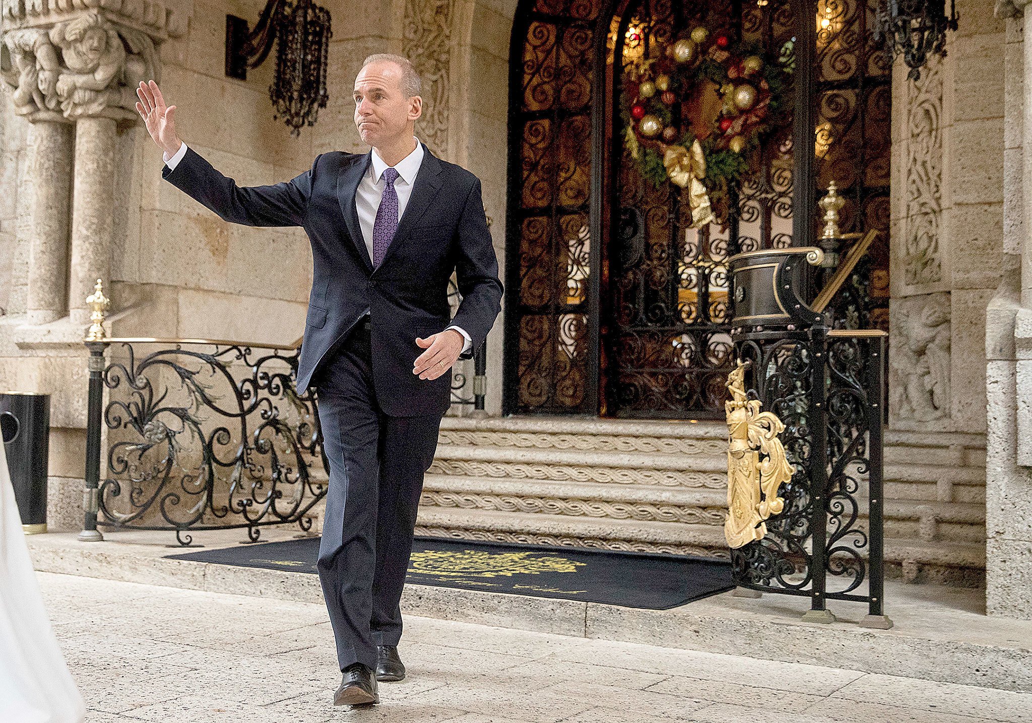 Boeing CEO Dennis Muilenburg departs Mar-a-Lago, in Palm Beach, Florida, after meeting with then-President-elect Donald Trump on Dec. 21. (AP Photo/Andrew Harnik)