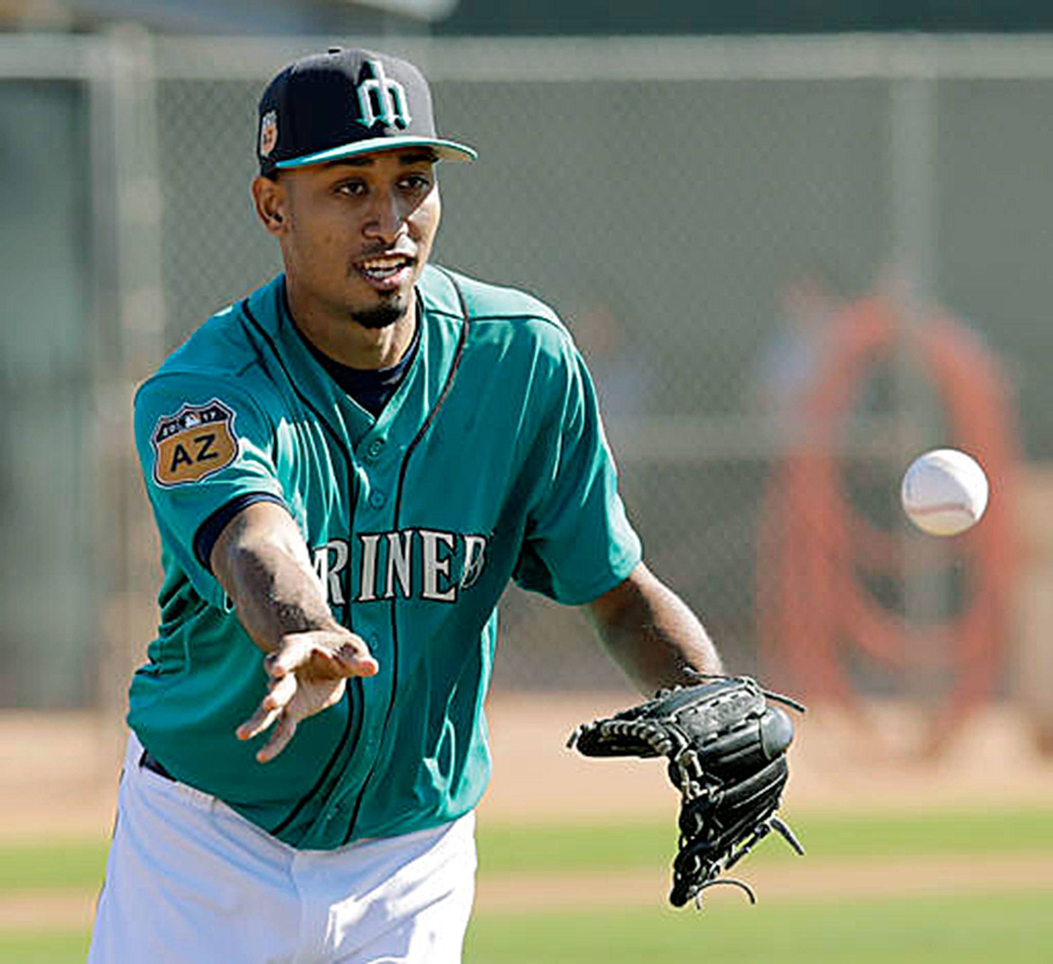 Seattle Mariners pitcher Edwin Diaz participates in a drill Wednesday at the team’s spring-training complex in Peoria, Arizona. (Charlie Riedel/Associated Press)