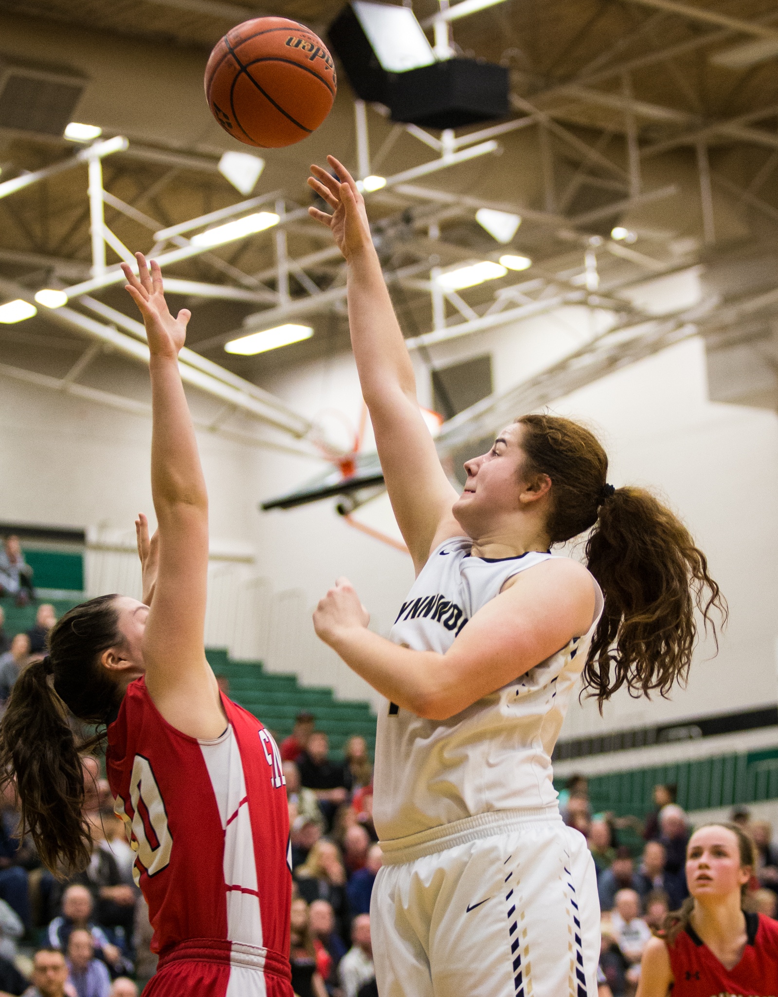 Lynnwood’s Kelsey Rogers shoots the ball over a Snohomish defender during the championship game of the 3A District 1 girls basketball tournament Feb. 17, 2017, at Jackson High School in Mill Creek. Lynnwood beat Snohomish 55-53. (Daniella Beccaria / The Herald)
