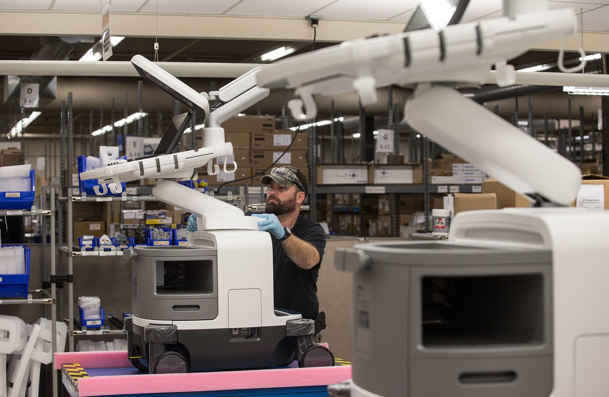 Materials handler 3 Terry Cline gets an Epiq Ultrasound machine ready for shipping at the Philips headquarters on the Bothell-Everett Highway. (Andy Bronson / The Herald)