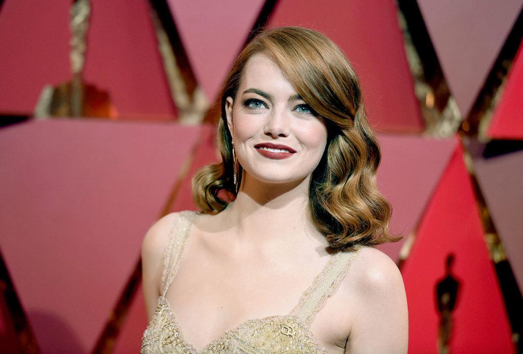 Emma Stone arrives at the Oscars on Sunday at the Dolby Theatre in Los Angeles. (Photo by Richard Shotwell/Invision/AP) 
