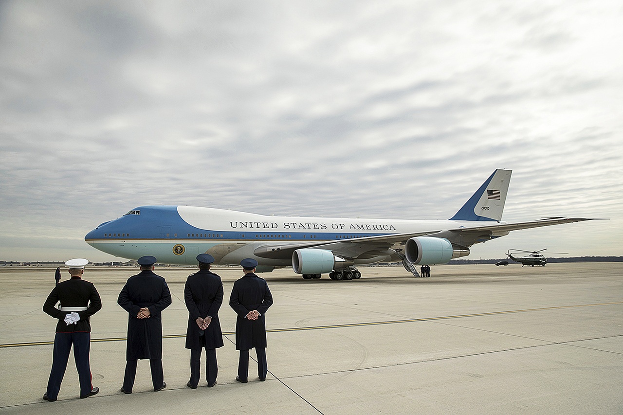 Military personnel watch as Air Force One, with President Donald Trump, aboard prepares to depart at Andrews Air Force Base in Maryland on Friday, Feb. 17. Trump is visiting Boeing South Carolina to see the Boeing 787 Dreamliner before heading to his estate Mar-a-Lago in Palm Beach, Florida, for the weekend. (AP Photo/Andrew Harnik)